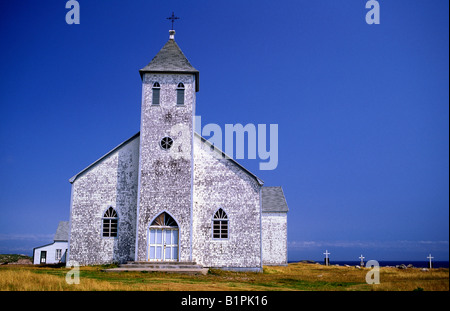 A weathered white church on Ile aux Marins, Saint Pierre et Miquelon Stock Photo