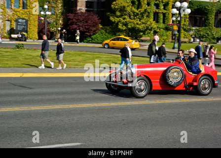 Vintage antique sports car in Victoria British Columbia with background motion blur Stock Photo