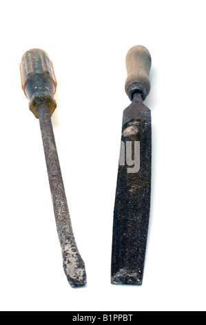 Old worn out rusty screwdriver and wooden handled half round file Stock Photo