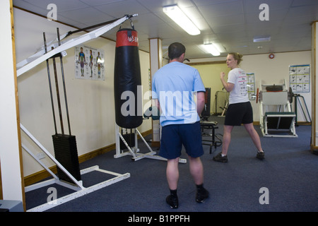 Boxing practice in a small gym Stock Photo