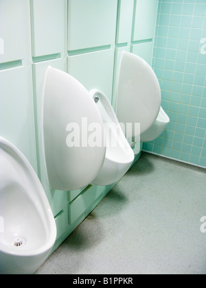 White urinals on wall in Men's toilet Stock Photo