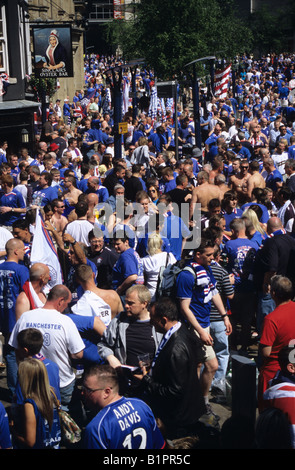 Large Crowd Of Rangers Football Fans In Manchester City Centre Stock Photo