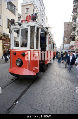 Nostalgic Tram Taksim to Tunnel or Tünel: The red and white narrow Nostalgic Tram number two splits this busy shopping street Stock Photo