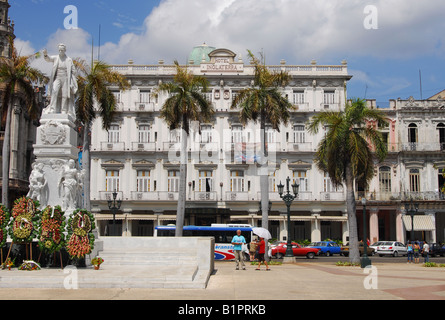Hotel Inglaterra behind palm trees and a statue of Jose Marti on Parque Central in Havana Cuba Stock Photo