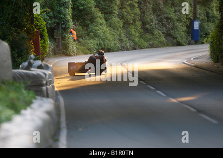 Dave Molyneux and Dan Sayle on their DMR Suzuki 600cc outfit exit Appledene during practice for the 2008 Isle of Man TT Races. Stock Photo