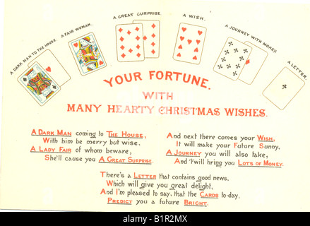 Christmas greeting card showing fortune telling with playing cards.   Circa 1895 Stock Photo