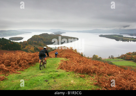 Mountain bikers descending Conic hill on The West Highland Way Stock Photo