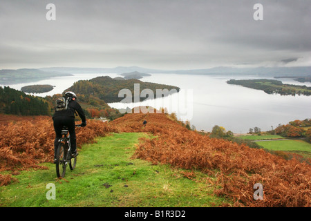 Mountain bikers descending Conic hill on The West Highland Way Stock Photo