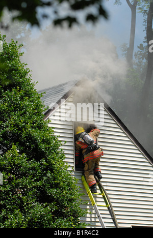 Firemen respond to extinguish a house fire in Maryland Stock Photo