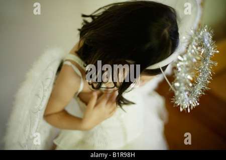 Girl aged four in angel costume Stock Photo