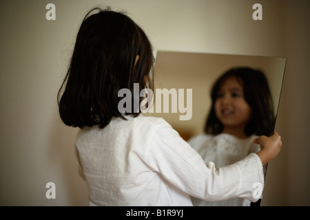 Child reflected in mirror Stock Photo