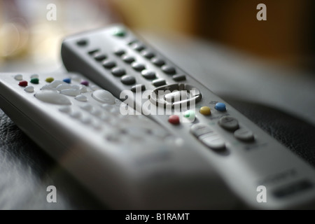 two remotes resting Stock Photo