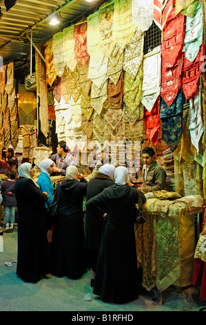 Shopping in the Material and clothing souk, Aleppo Bazaar, UNESCO world heritage site, Syria, Arabia, Middle East Stock Photo