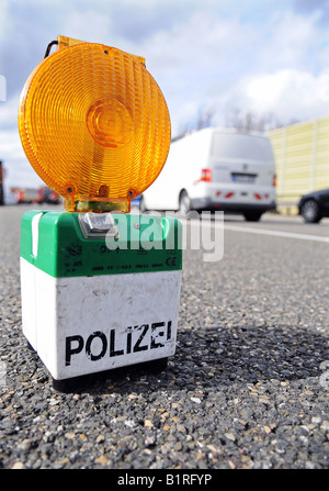 Orange flashing police warning light used for closing traffic lanes after an accident on the A8 toward Karlsruhe, Denkendorf, E Stock Photo