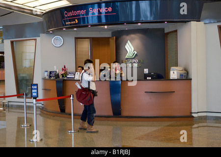 Singapore Airlines Customer Service Information Desk in the departures hall of Changi Airport, Singapore, Southeast Asia Stock Photo