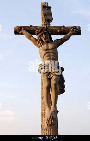 Stone statue of Jesus on the cross, crucifix, Ribeauvillee, Alsace, France, Europe Stock Photo