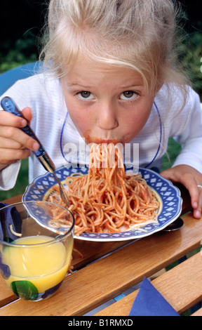 Eating spaghetti, girl Stock Photo