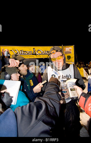 Yukon Quest Sled Dog Race musher Ken Anderson, in an interview after arriving second in Whitehorse, Yukon Territory, Canada Stock Photo