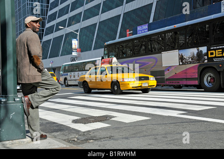 Pedestrian waiting in front of the W. R. Grace Building, Manhattan, New York City, USA Stock Photo