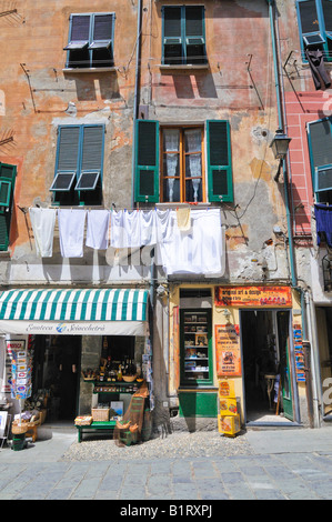 Facade of a house with a small shop and clotheslines, Vernazzo, Liguria, Cinque Terre, Italy, Europe Stock Photo