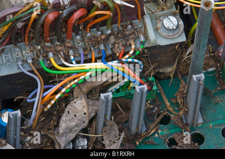 Dirty electronic device with coloured wires Stock Photo