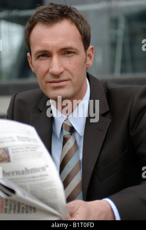 31-year-old man wearing open shirt looking out of a window Stock Photo ...