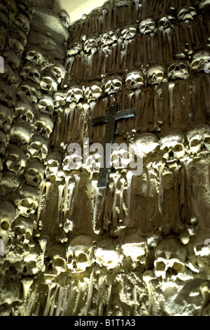 Wall decorated with human remains and a cross in the Chapel of Bones,  Church of St Francis,  Evora, Alentejo, Portugal, Europe Stock Photo