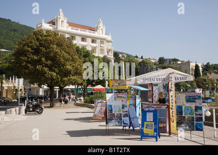 Opatija Istria Croatia Europe Sightseeing tour operator advertising stand on seafront promenade in tourist resort Stock Photo