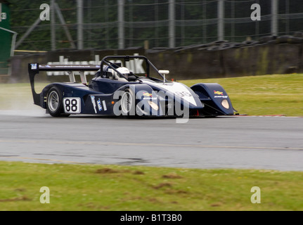 A V de V Juno SSE Sports Racing Car Exits Old Hall Corner at Oulton Park Motor Racing Circuit Cheshire England UK Stock Photo