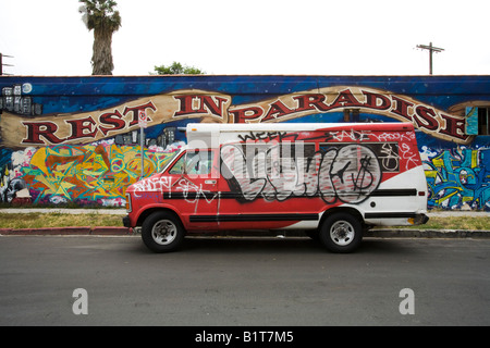 Rest in Paradise mural and van with graffiti near Venice Blvd Los Angeles California United States of America Stock Photo