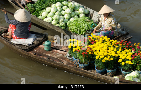 Flower and vegetable sellers Cai Rang Floating Market Mekong Delta Vietnam Stock Photo