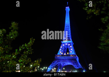The Eiffel tower illuminated with the yellow and blue colours of the European Union flags in Paris, France. Stock Photo
