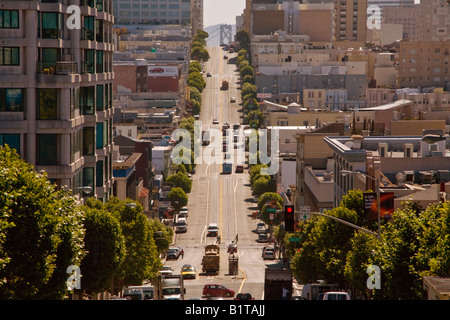 Cable cars share the steep Eastbound slope of San Francisco s California Street with regular traffic Stock Photo