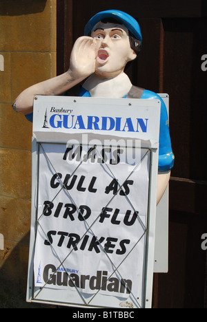 Paper-boy stand with Banbury Guardian Newspaper headlines , High Street, Chipping Norton, Oxfordshire, England, United Kingdom Stock Photo