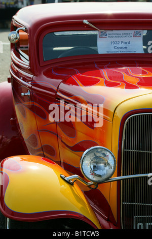 1934, ford,hot rod, custom car, 34 coupe, modified car, red, flames, chrome, peep mirror, lush, paint, paint job, gleaming Stock Photo