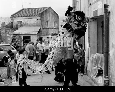 Lion dance first footing at Chinese New Year Stanley Village Hong Kong 1978 Stock Photo