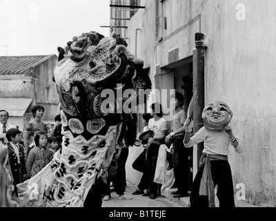Lion dance first footing at Chinese New Year Stanley Village Hong Kong 1978 Stock Photo