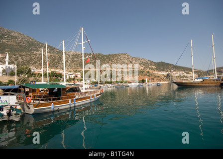 Kalkan in Turkey. A scenic photograph of a boating village on a hot summer day. Harbour for tourists to visit on summer holidays. Turkish coast. Stock Photo