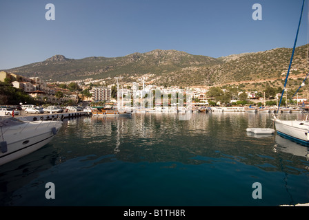 Kalkan in Turkey. A scenic photograph of a boating village on a hot summer day. Harbour for tourists to visit on summer holidays. Turkish coast. Stock Photo