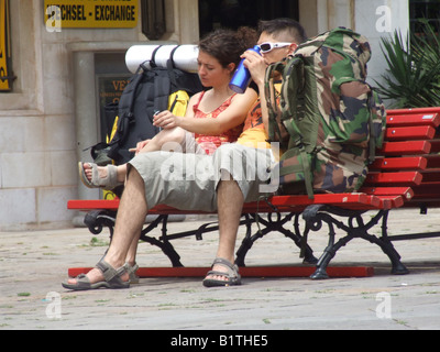 young couple travellers with rucksacks in street in venice, italy Stock Photo