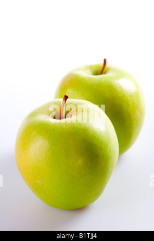 two green apples on white background with shadows Stock Photo