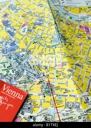 A tourist guide book and street map of central Vienna Austria Stock Photo