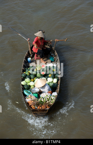 Melon and vegetable sellers Cai Rang Floating Market Mekong Delta Vietnam Stock Photo