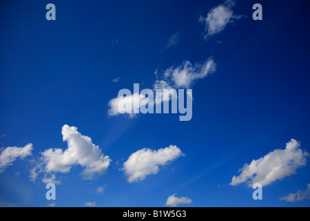 Cumulus Fractus clouds in a deep blue polarised sky England Britain UK Stock Photo