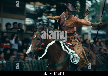 JAPAN Honshu Kamakura Yabusame mounted archery at Hachimangu shrine festival. Horseback archery has been a feature of the shrine Stock Photo