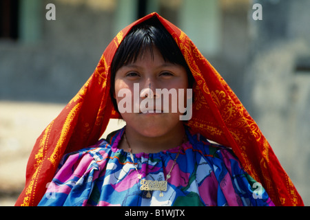 PANAMA San Blas Islands Portrait of young Kuna Indian girl wearing traditional gold nose ring with black line drawn down nose Stock Photo