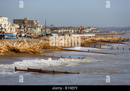 ENGLAND West Sussex Worthing Timber on beach from shipwrecked Ice Princess with wood between groynes at high water mark Stock Photo