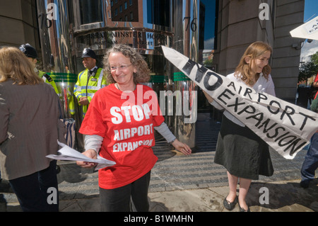 Jenny Jones at Stop Airport Expansion Flash Mob at DfT in Westminster against third runway for Heathrow with paper plane Stock Photo