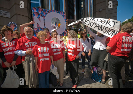 Stop Airport Expansion Flash Mob protest at DfT in Westminster against third runway for Heathrow with large paper plane Stock Photo