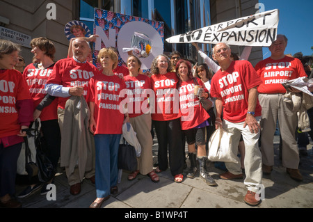 Stop Airport Expansion Flash Mob protest at DfT in Westminster against third runway for Heathrow with large paper plane Stock Photo